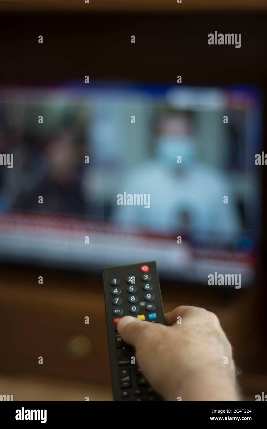Someone who constantly changes channels while watching TV. selective focus remote control Stock Photo