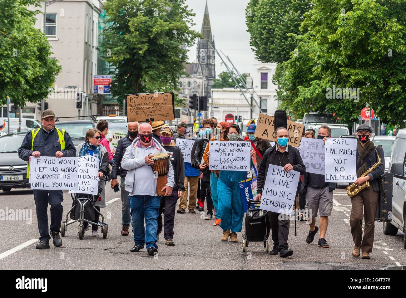 Cork, Ireland. 23rd June, 2021. Around 40 Cork musicians held a silent protest in Cork City this afternoon. The protest highlighted the fact musicians haven't been able to play live for 15 months due to COVID-19. The musicians marched down South Mall, Merchant Quay and Patrick Street before holding a rally on Grand Parade. Credit: AG News/Alamy Live News Stock Photo