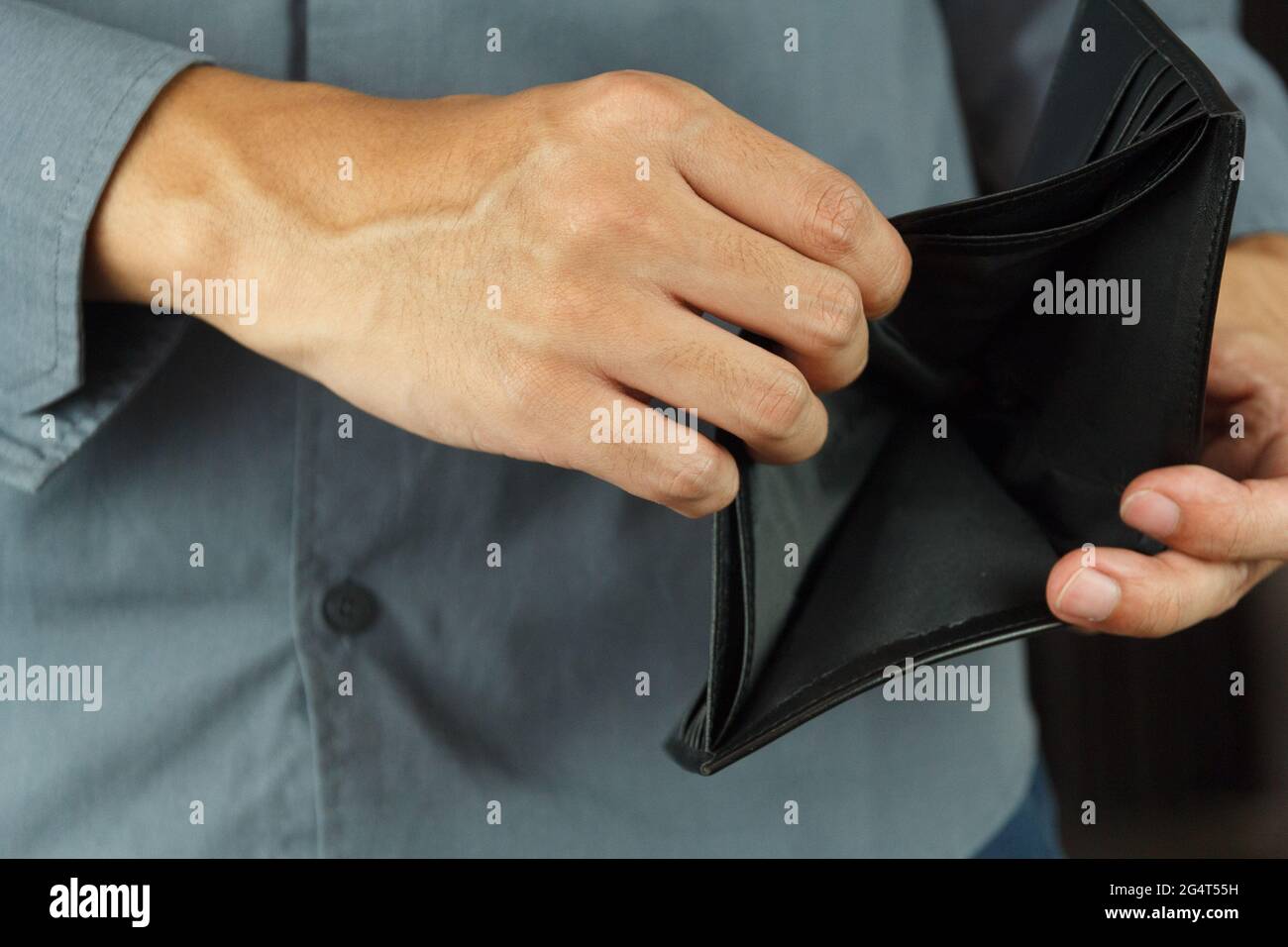 A Closeup hand man open an Empty Wallet. Stock Photo