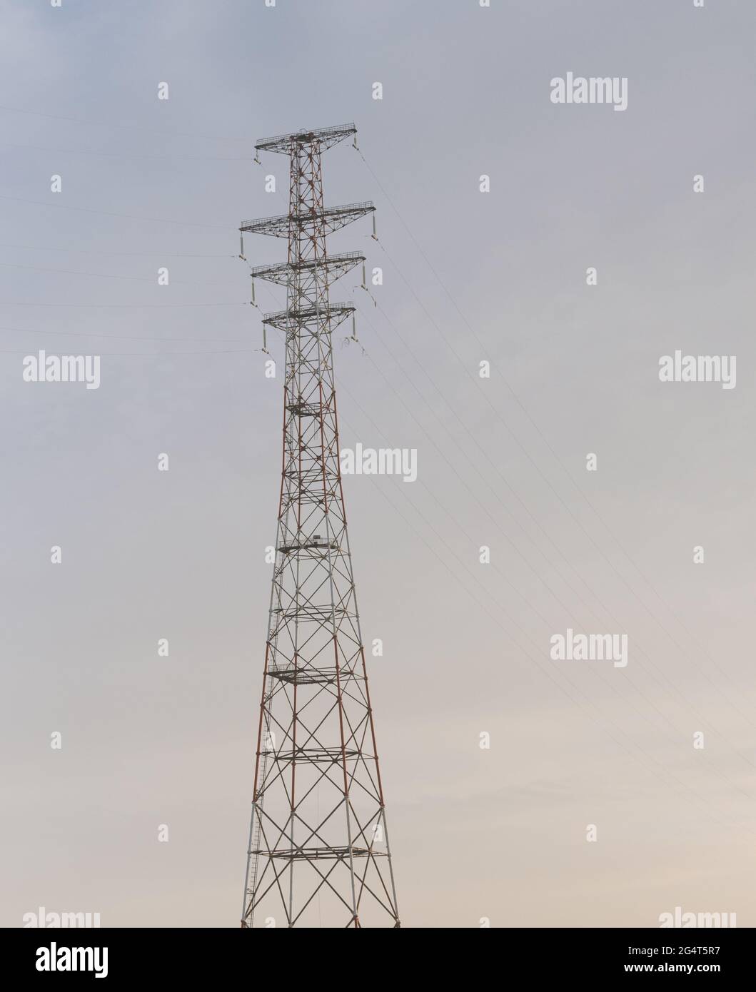 Hight-voltage electric power lines at sunset. Stock Photo