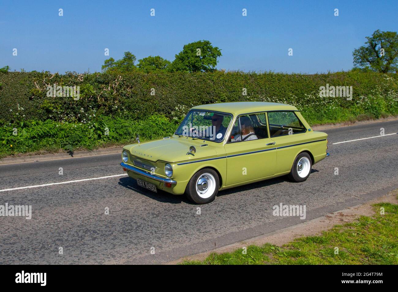 1966 60s Hillman Imp Super, 875cc 2dr en-route to Capesthorne Hall classic May car show, Cheshire, UK Stock Photo