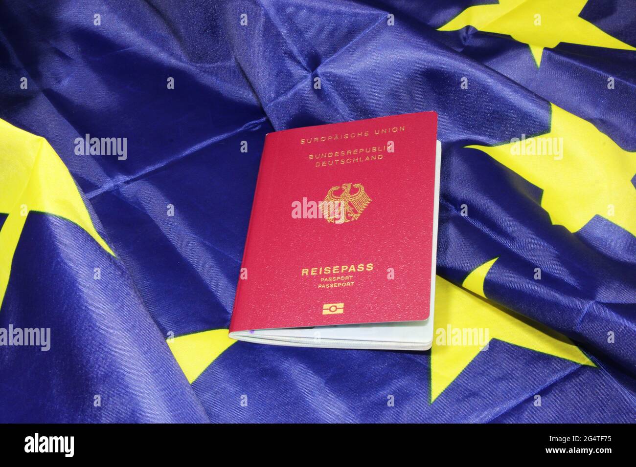 Symbol image freedom of travel German passport on a European flag