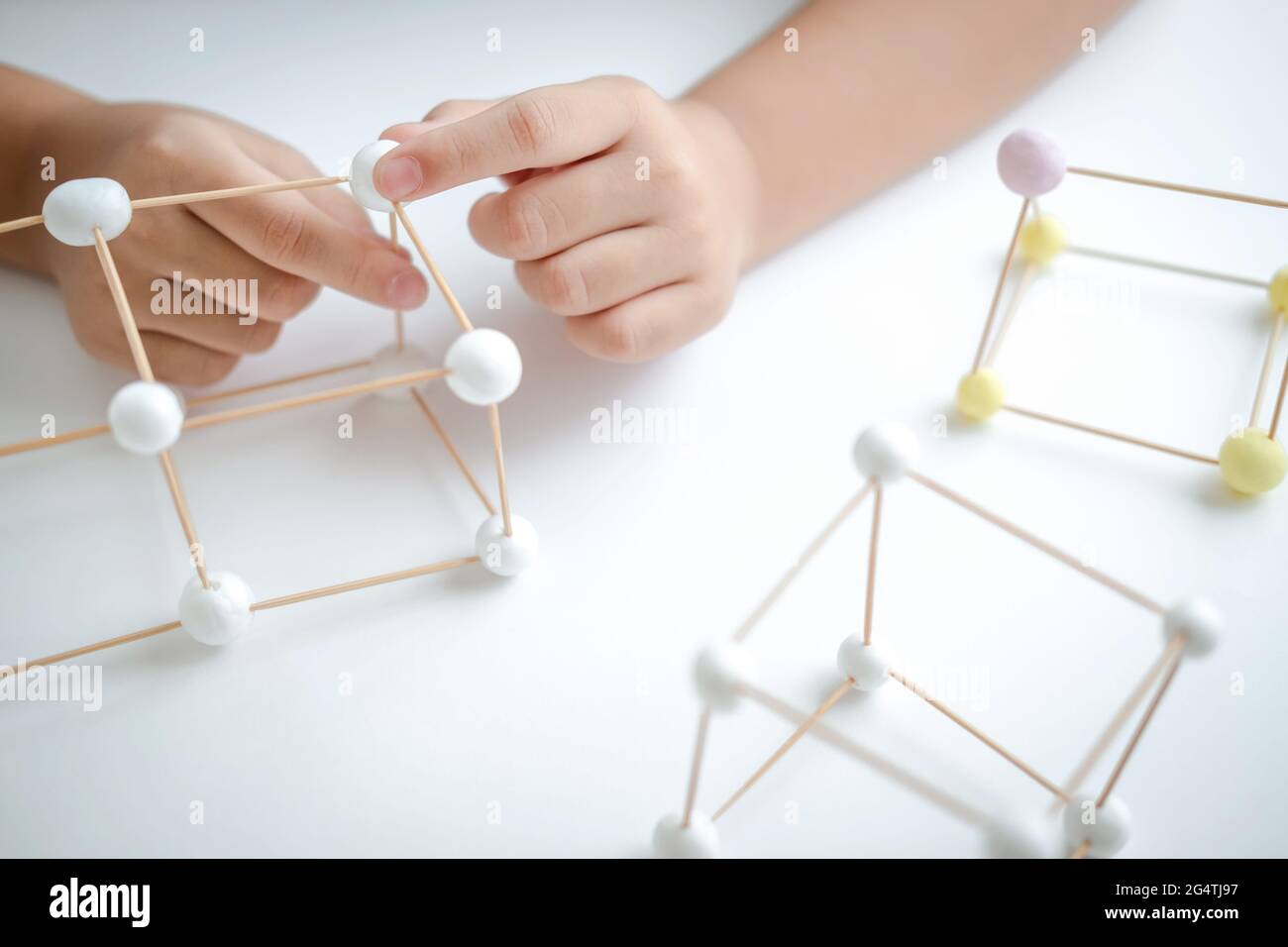 STEM education, Child learning making 3D geometric shapes, Building ...
