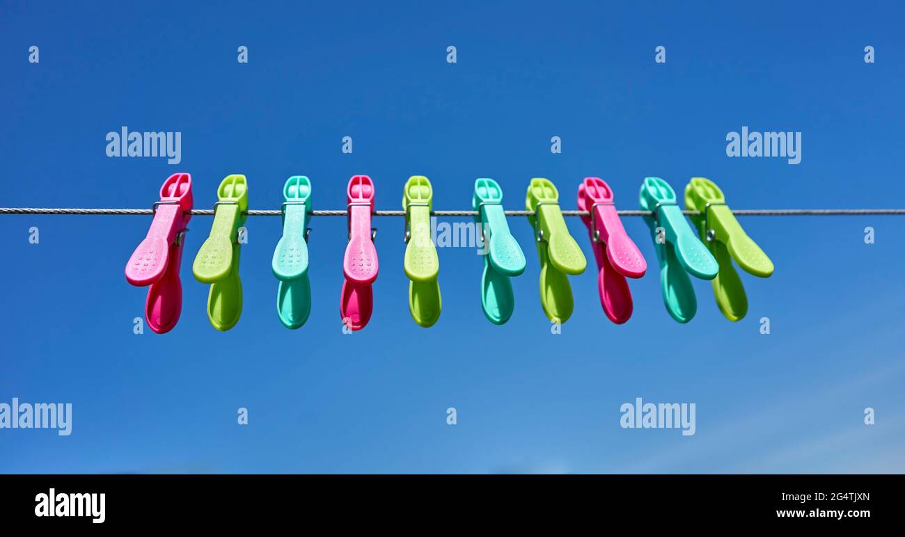 Yellow plastic clothes pegs hires stock photography and images Alamy