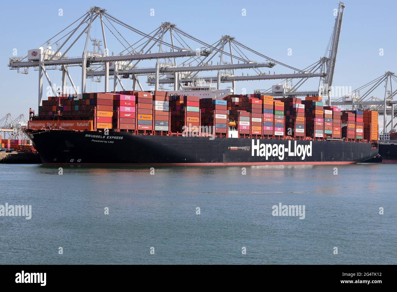 The Brussels Express container ship will be unloaded in the port of Rotterdam on May 29, 2021. Stock Photo