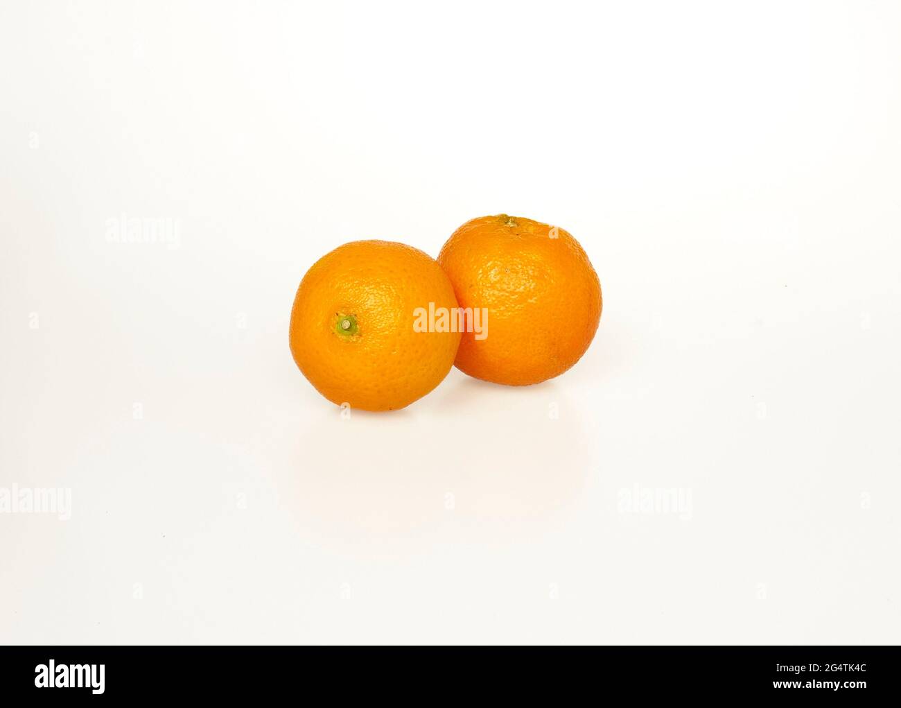 two ripe tangerines on a white background Stock Photo