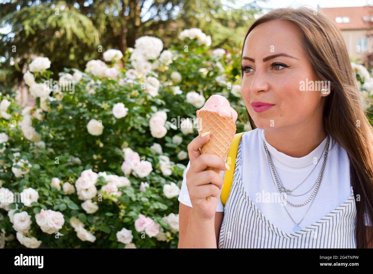 Woman eating ice cream, outdoors Stock Photo Alamy