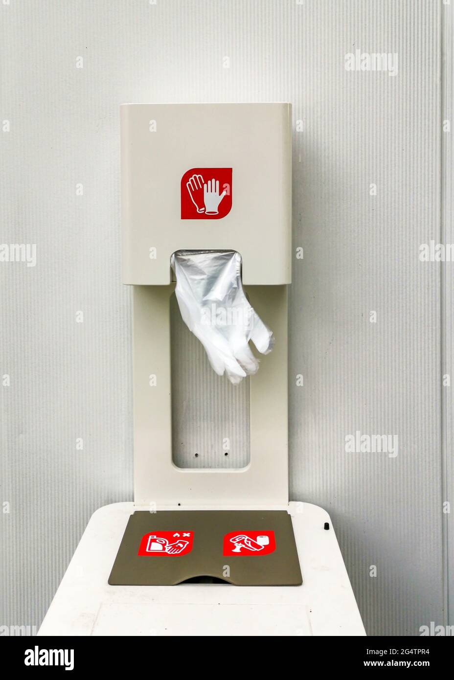 dispenser with one-time plastic gloves for self-protection Stock Photo