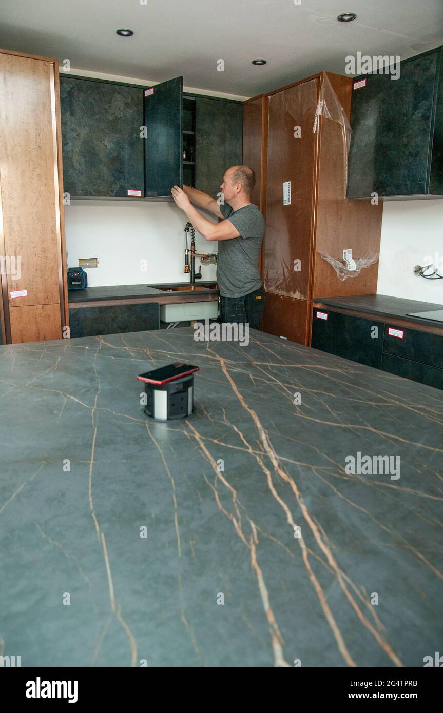 Kitchen Fitter At Work Stock Photo Alamy