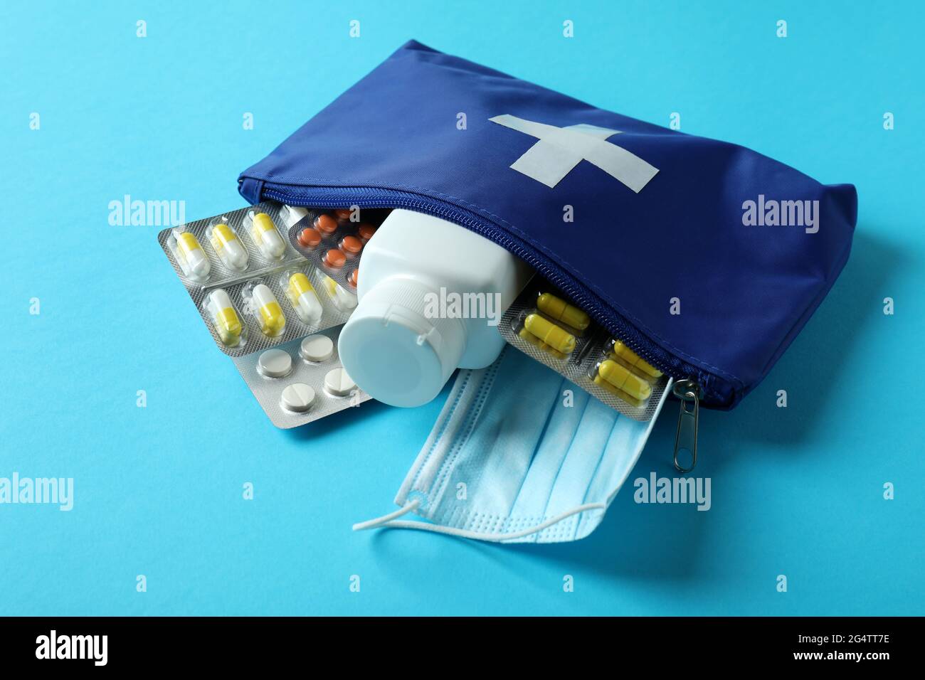 First aid medical kit on blue background Stock Photo - Alamy