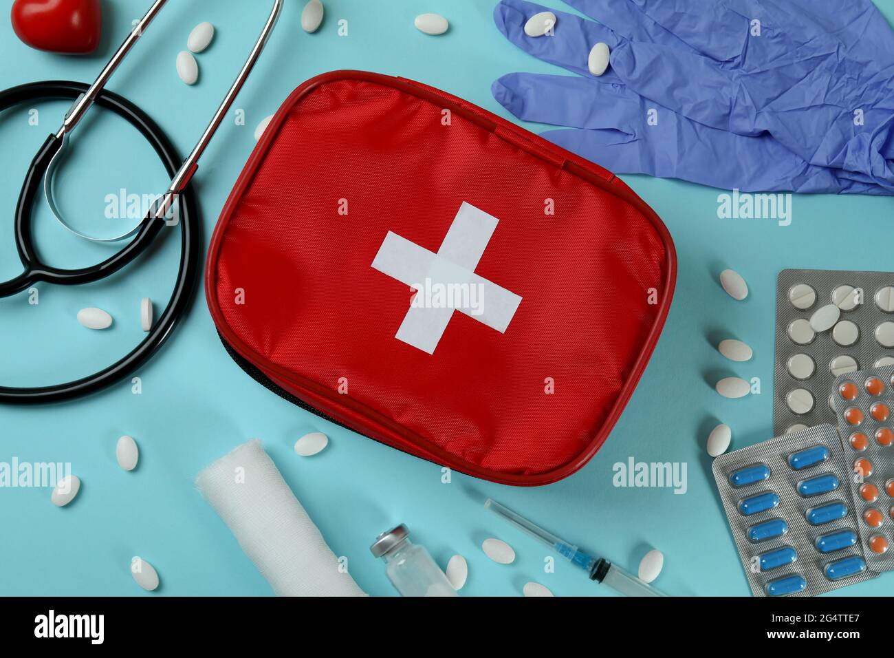 First aid medical kit on blue background Stock Photo - Alamy