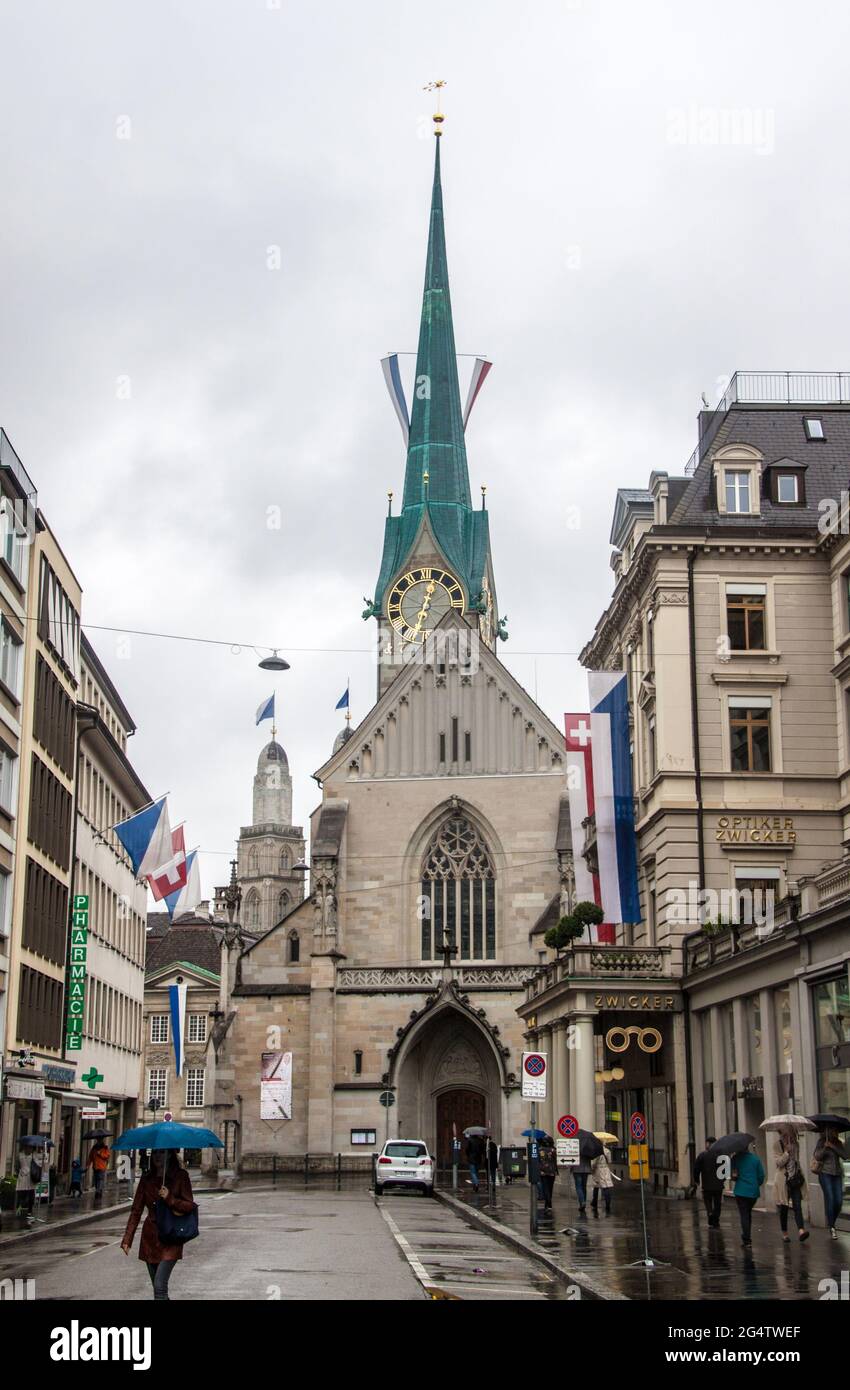 ZURICH - APRIL 28: View of a street and church on April 28, 2014 in Zurich, Switzerland. Zurich is the largest city in Switzerland and the capital of Stock Photo