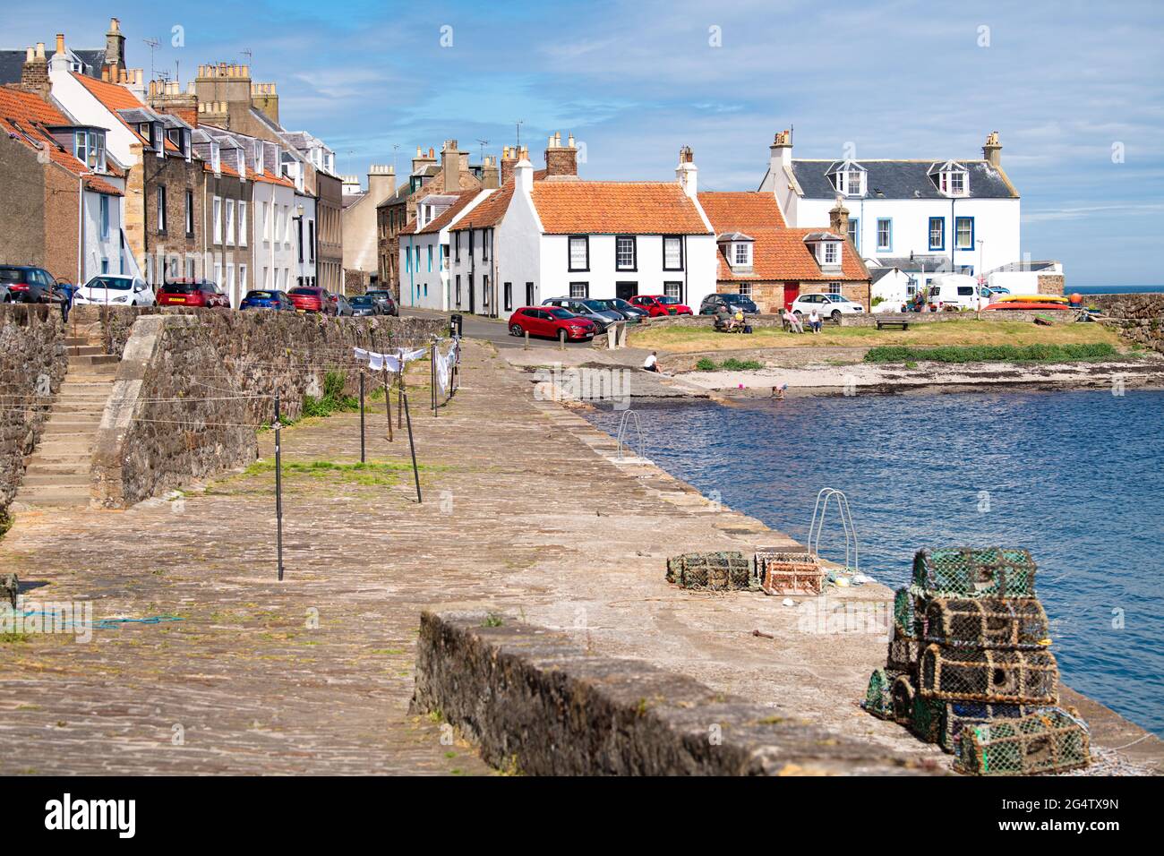 Cellardyke, East Neuk of Fife, Scotland, UK. 23rd June, 2021. UK Weather: sunshine in the village of Cellardyke ahead of the East Neuk Open Studios weekend on the 26th and 27th June. The work of the area's local artists, designers and makers will be exhibited at the Bowhouse near St Monans and several artists will be opening their own venues including some at Cellardyke Credit: Kay Roxby/Alamy Live News Stock Photo