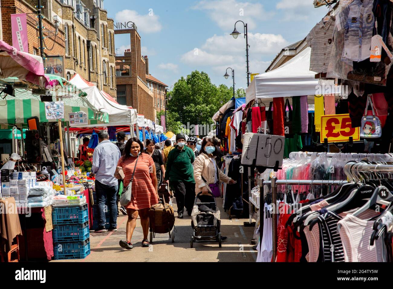 London, UK. 23rd June, 2021. Shoppers in protective face masks are