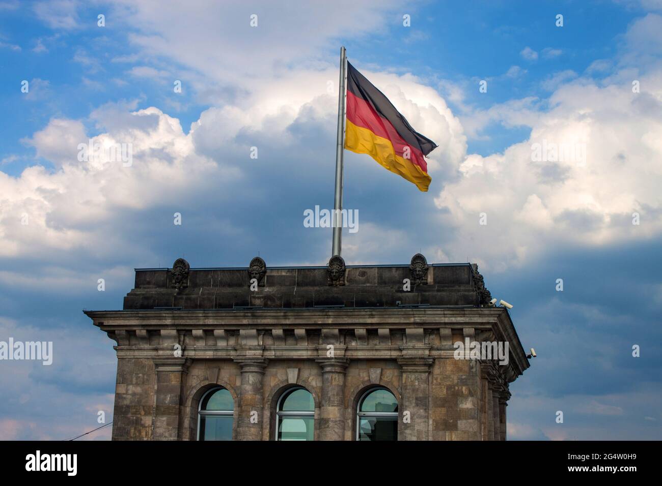 Tower with German flag on the top of Reichstag building, Berlin, Germany Stock Photo
