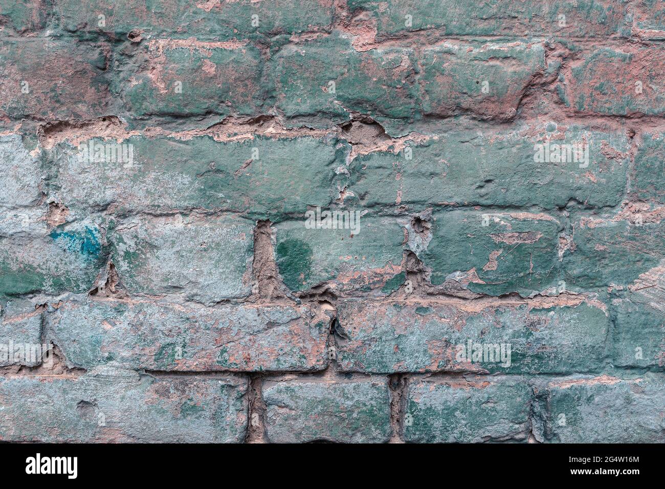 Old authentic brick wall cracks and collapses Stock Photo