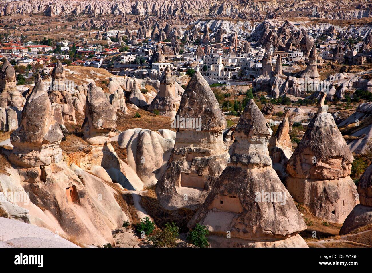 Partial view of picturesque Goreme village surrounded by the spectacular landscape of Cappadocia on the edge of Pigeon valley, Nevsehir, Turkey Stock Photo