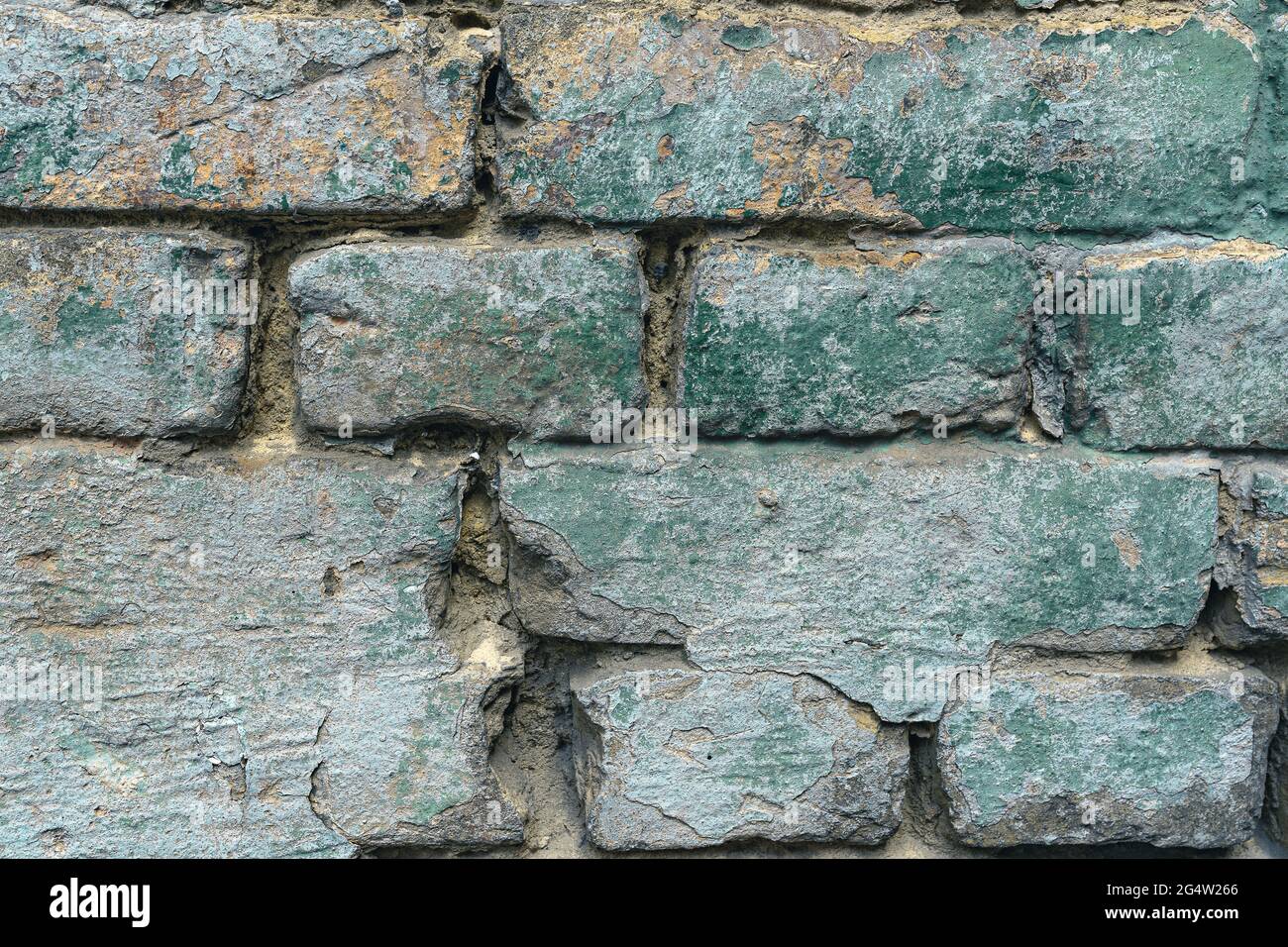 Old authentic brick wall cracks and collapses Stock Photo
