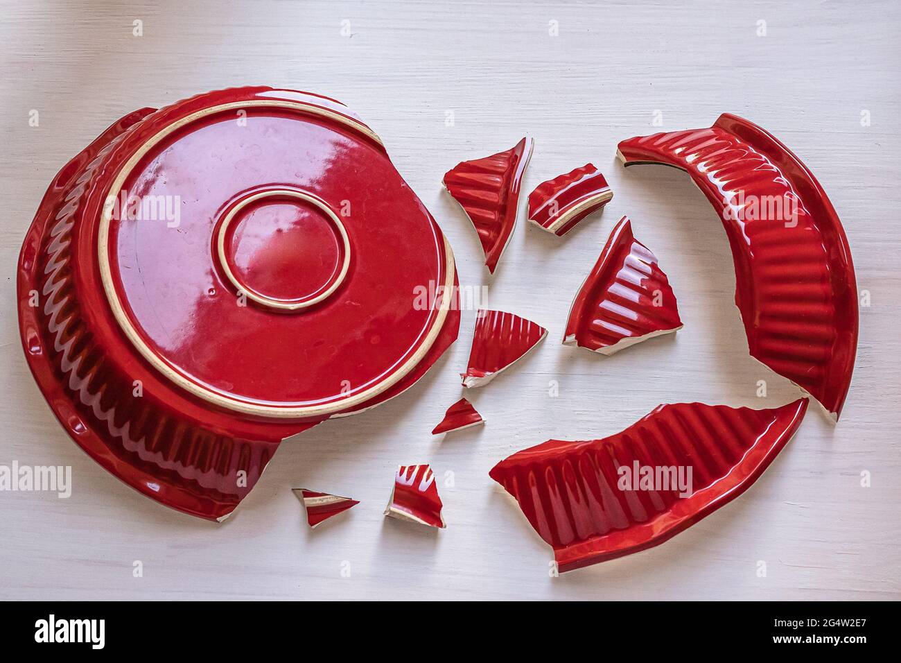 shards of broken red dishes Stock Photo