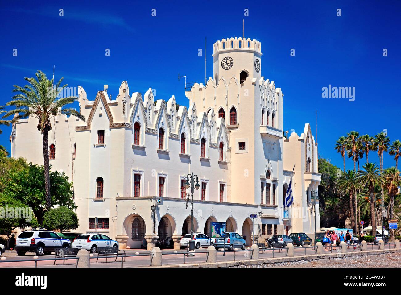 Typical building of the Italian Era ('Residency') and the Castle of Neratzia, Kos town, Kos island, Dodecanese, Greece. Stock Photo