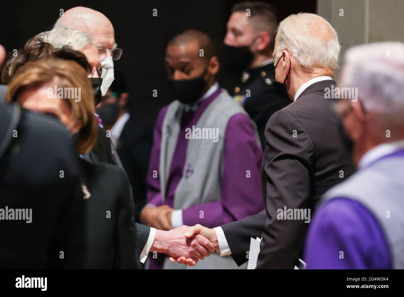U.S. President Joe Biden shakes hands with Senate Minority Leader Mitch McConnell (R-KY) after the funeral ceremony of former Senator John Warner at Washington National Cathedral in Washington, DC, U.S. June 23, 2021. Oliver Contreras/Pool via REUTERS Stock Photo