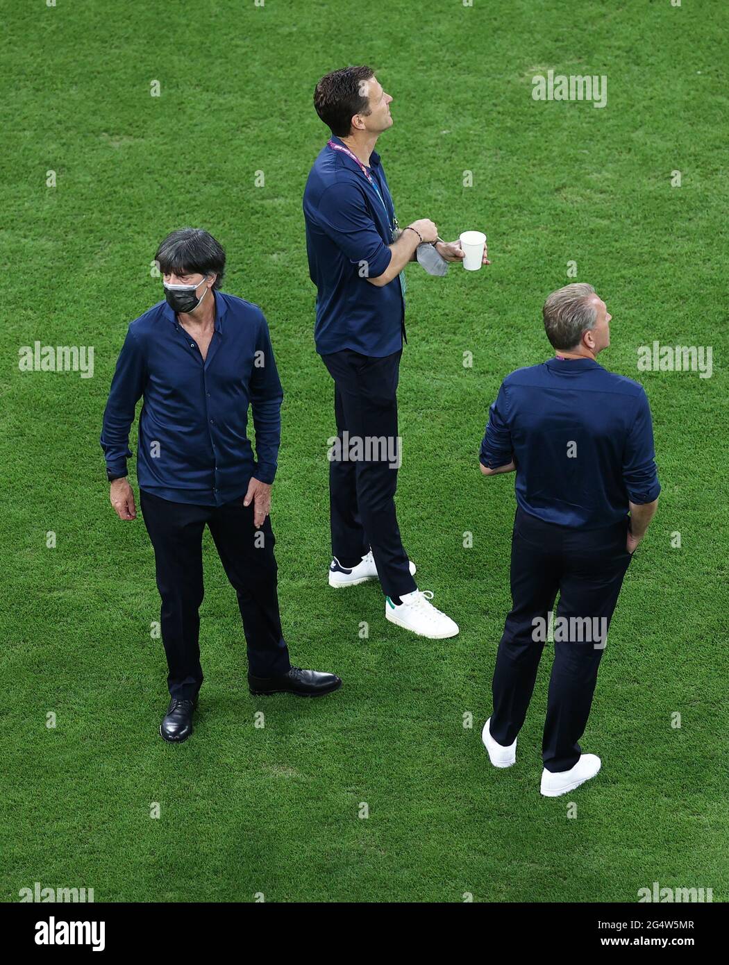 Munich, Germany. 23rd June, 2021. Football: European Championship, Germany - Hungary, preliminary round, Group F, match day 3 at the EM Arena in Munich. German coach Joachim Löw, Oliver Bierhoff, team manager of the German national team, and Andreas Köpke (l-r), goalkeeper coach, are on the pitch. Credit: Christian Charisius/dpa/Alamy Live News Stock Photo