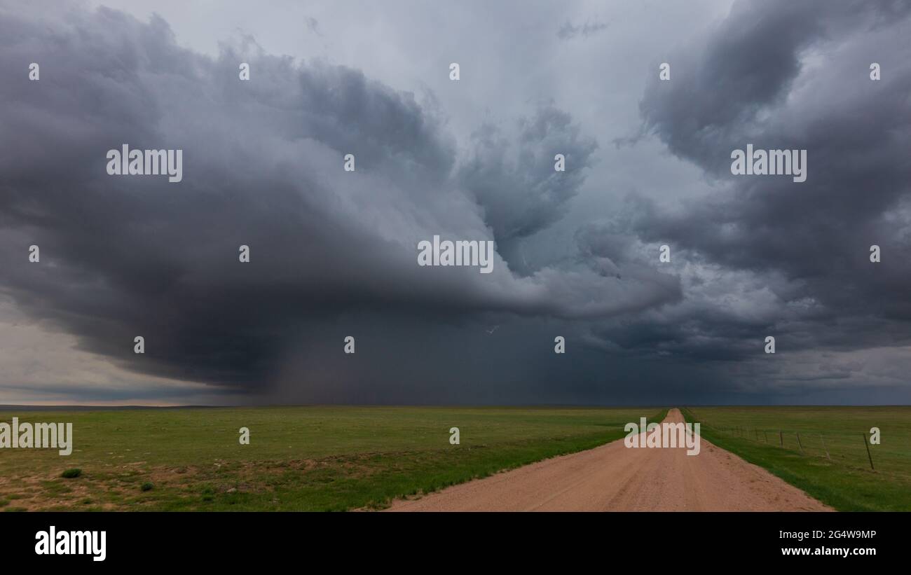 Supercell thunderstorm along the eastern plains of Colorado with a shaft of rain pouring down Stock Photo