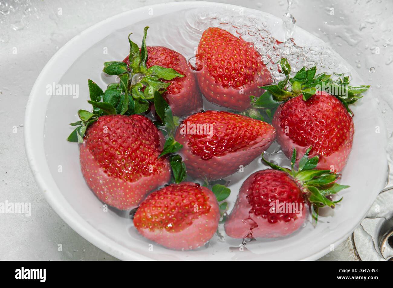 Fresh strawberries in a bowl on a textile background Stock Photo - Alamy