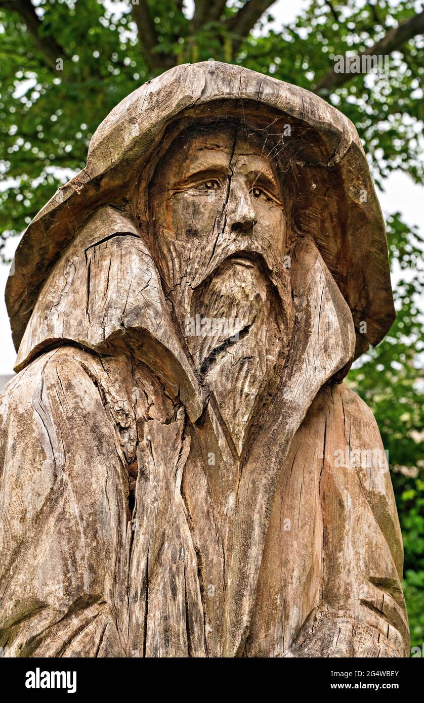Chainsaw carving of Fisherman (standing opposite his Lady) by Tim Burgess at Holy Trinity churchyard, Morecambe, Lancashire Stock Photo