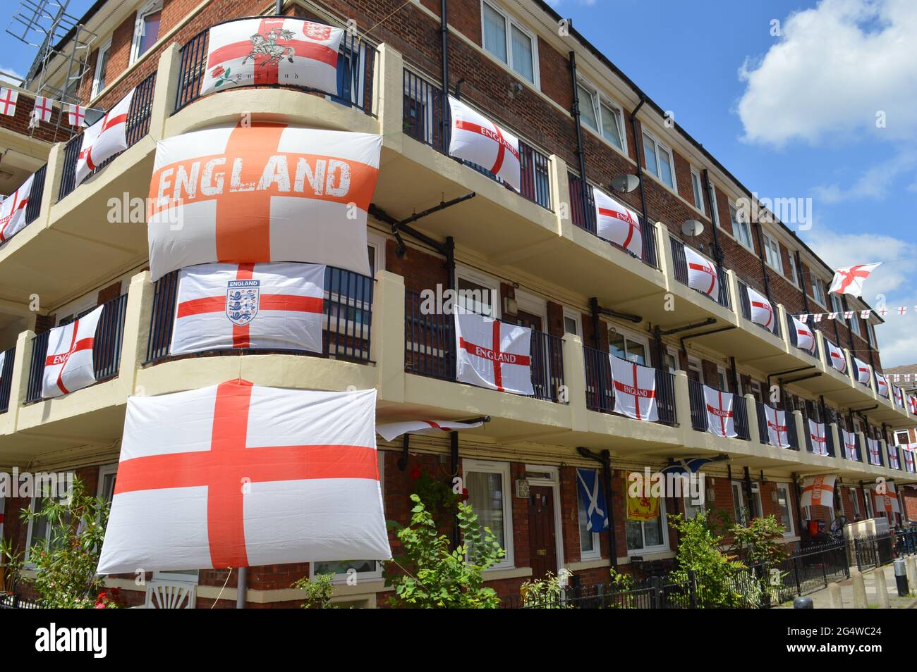 London, UK. 23 June 2021. Patriotic residents in Kirby Estate cover their balconies in England flags for duration of the Euro 2020 tournament. Stock Photo