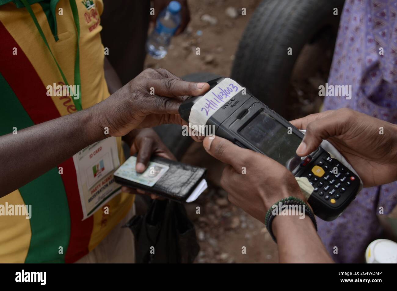 An election official records a voter identity at a polling station. Nigerians vote in Africas biggest democracy in a tight presidential race between incumbent Muhammadu Buhari and pro-market multimillionaire Atiku Abubakar. Lagos, Nigeria. Stock Photo