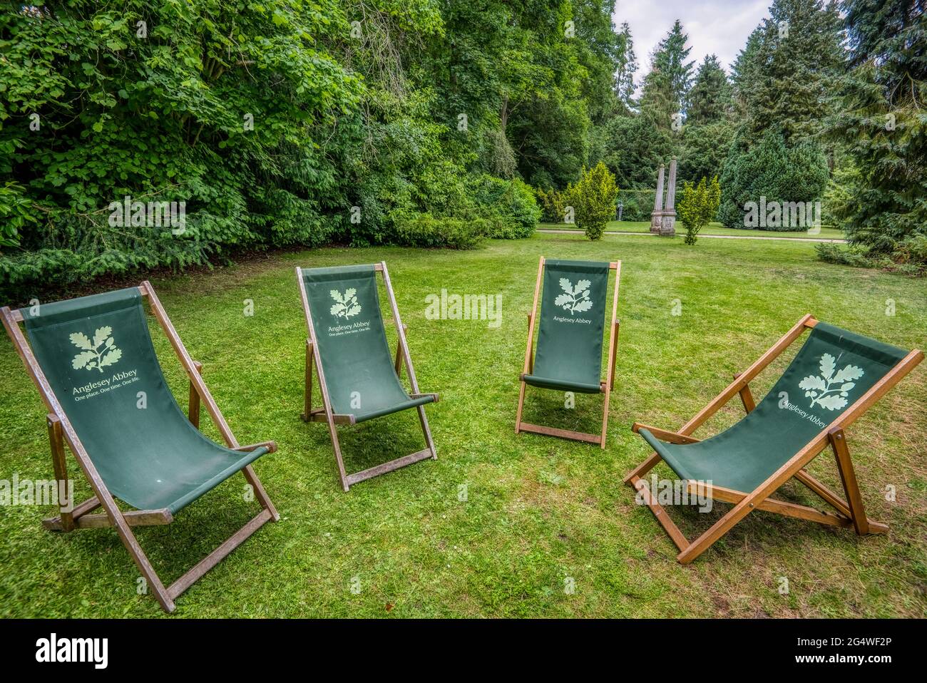 Take a load off. A semi-circie of deckchairs await visitors to Anglesey Abbey, a Jacobean-style country house at Lode, near Camdridge, UK, Stock Photo