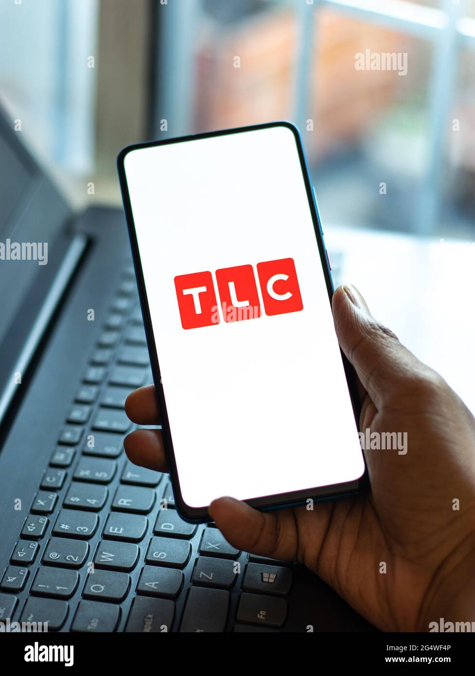 TLC logo on phone screen stock image Stock Photo - Alamy