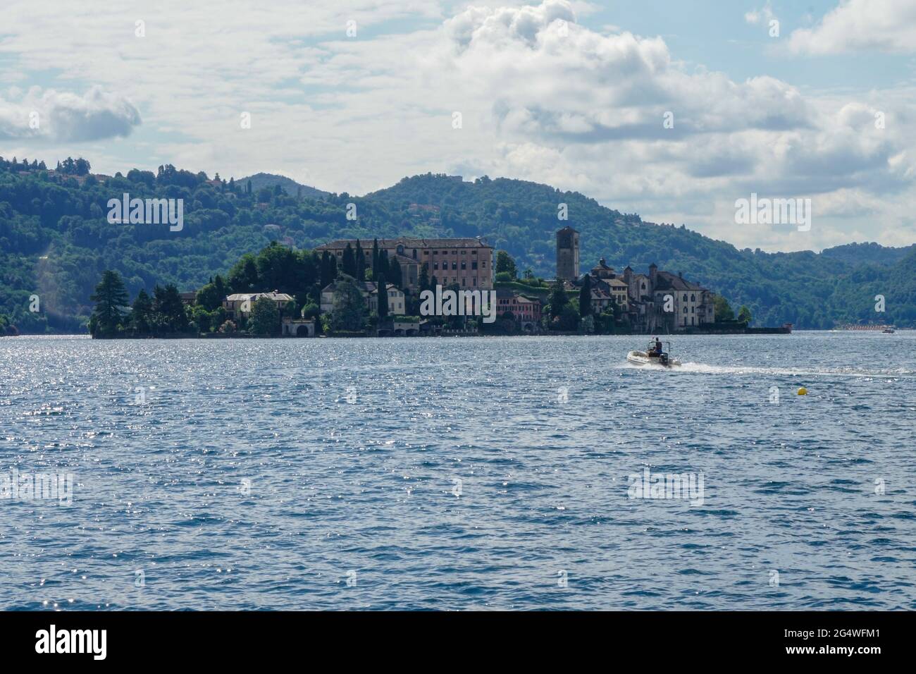 Pella - 07/12/2020: view of Isle San Giulio with nautical dinghy Stock Photo