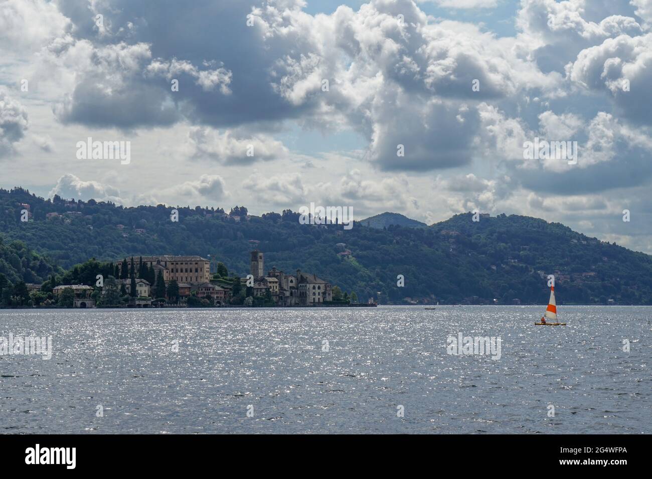 Pella - 07/12/2020: view of San Giulio isle and little sailing boat Stock Photo