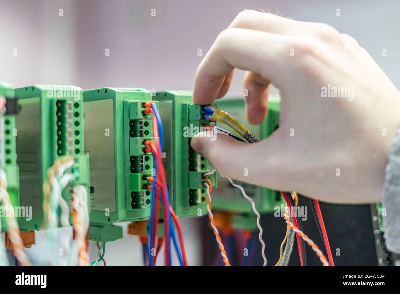 bunch of wires inserted in elctric controller Stock Photo