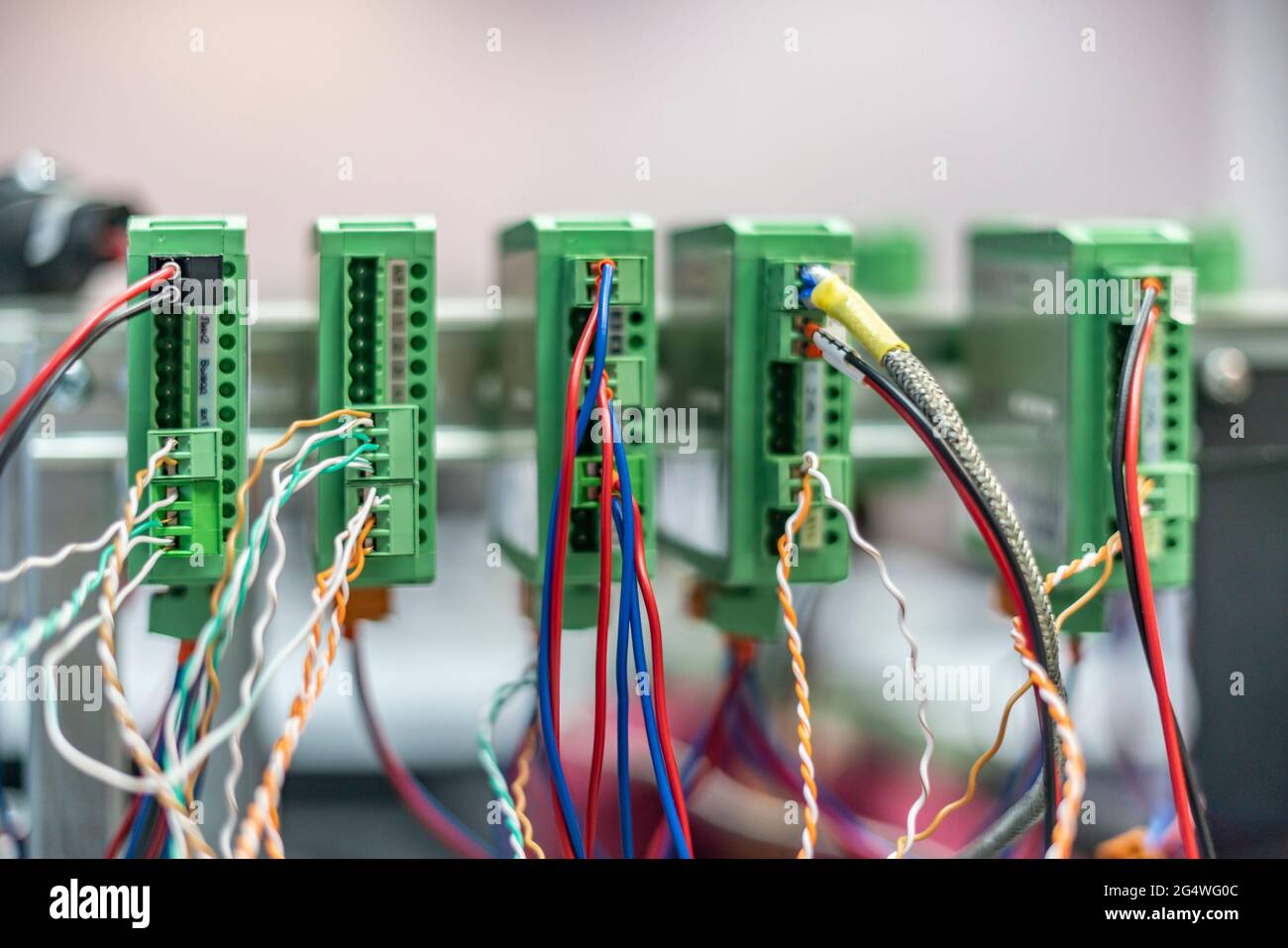 bunch of wires inserted in elctric controller Stock Photo