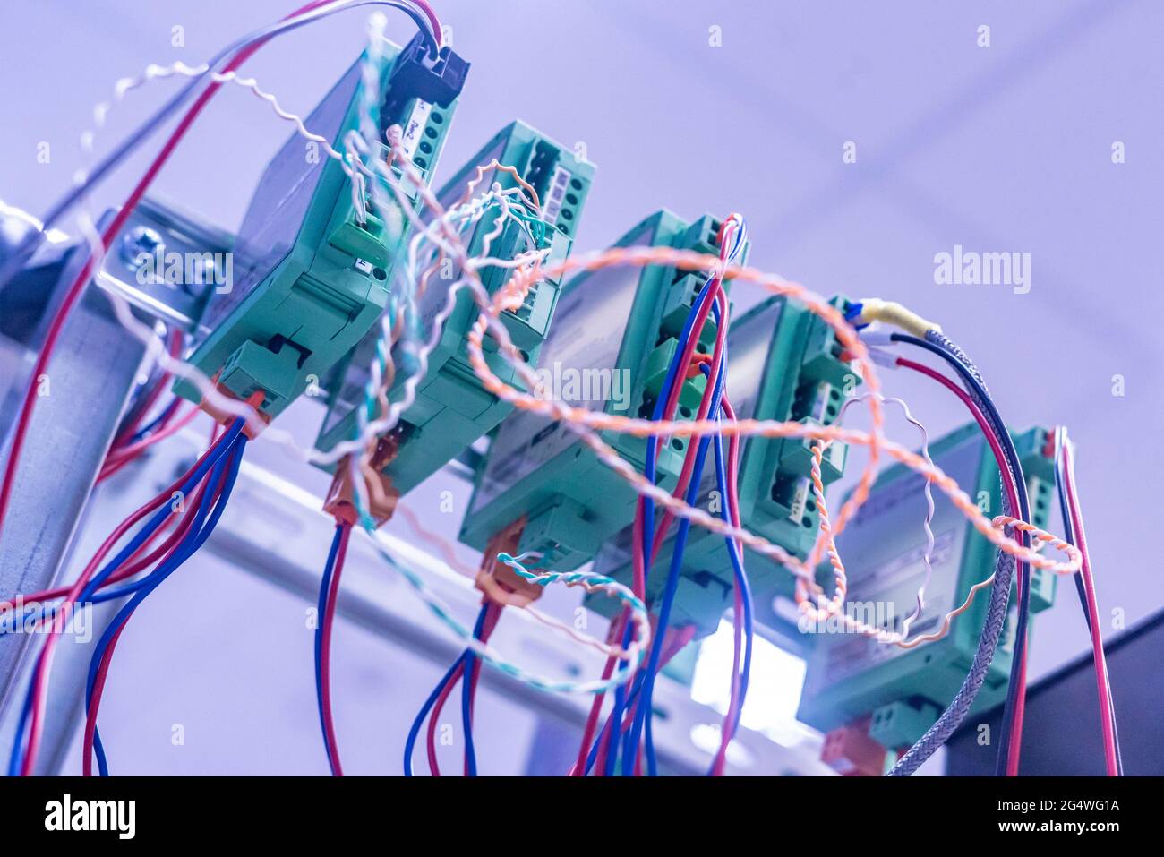 bunch of wires inserted in elctric controller Stock Photo