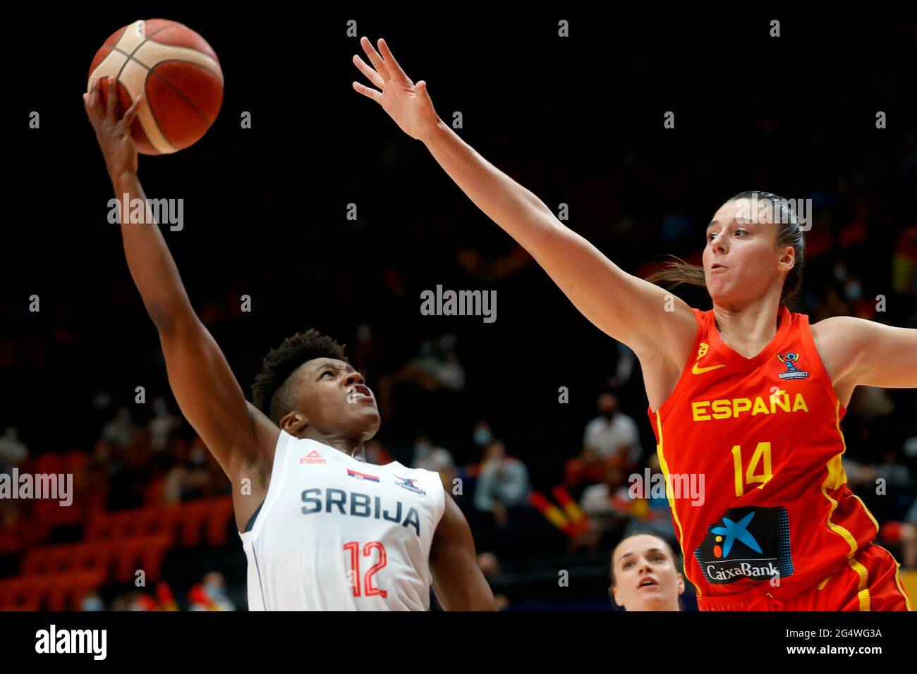 Spain's Raquel Carrera (R) tries to block Serbia's Yvonne Anderson (L)  during the Eurobasket 2021 quarterfinal match between Spain and Serbia,  played in Fuente de San Luis arena, Valencia, Spain, 23 June