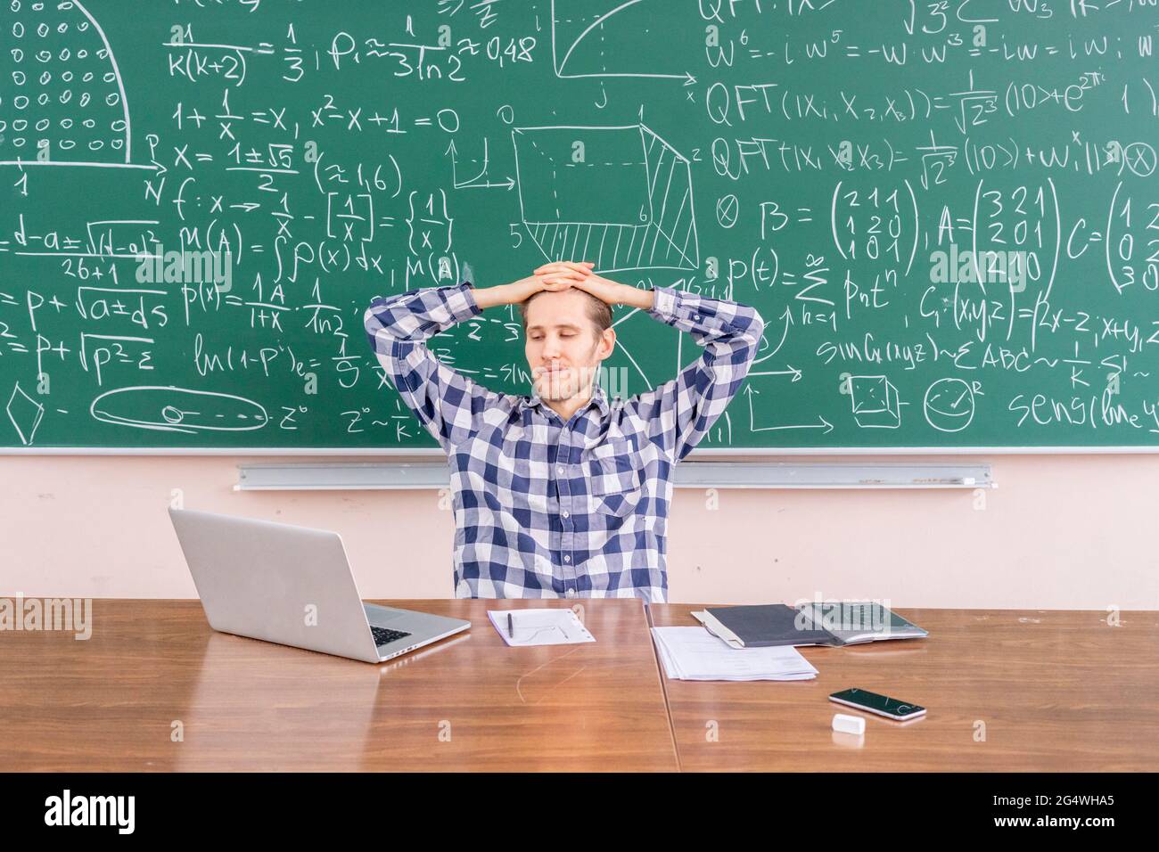 Happy smart scientist sitting hi-res stock photography and images - Alamy