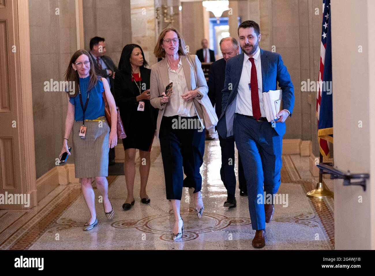 Louisa Terrell, White House Legislative Affairs Director, center, Brian Deese, Director of the National Economic Council, right, and Steve Richetti, Counselor to the President, rear, leave a bipartisan meeting of Senators where they discussed infrastructure legislation, at the U.S. Capitol, in Washington, D.C., on Wednesday, June 23, 2021. Last night Senate Republicans filibustered a voting rights bill as bipartisan negotiations over infrastructure legislation grind on with little apparent progress building a package to beat the 60-vote filibuster threshold. (Graeme Sloan/Sipa USA) Stock Photo