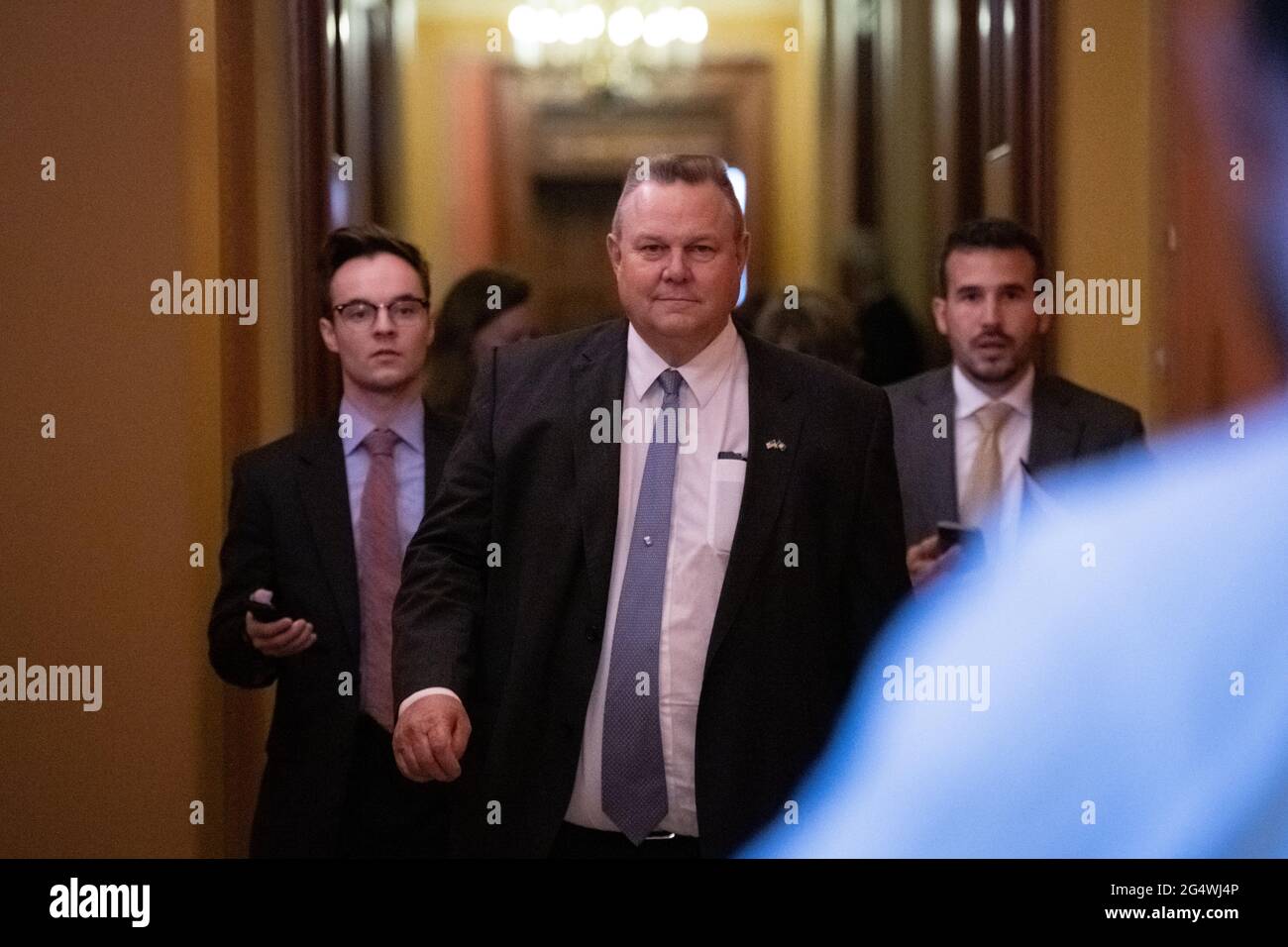 Washington, USA. 23rd June, 2021. Senator Jon Tester (D-MT) leaves a bipartisan meeting of Senators where they discussed infrastructure legislation, at the U.S. Capitol, in Washington, DC, on Wednesday, June 23, 2021. Last night Senate Republicans filibustered a voting rights bill as bipartisan negotiations over infrastructure legislation grind on with little apparent progress building a package to beat the 60-vote filibuster threshold. (Graeme Sloan/Sipa USA) Credit: Sipa USA/Alamy Live News Stock Photo
