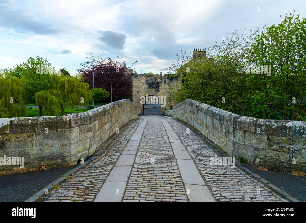 The Cobbled Bridge Deck of Warkworth Medieval Brudge at Warkworth, Northumberland Stock Photo