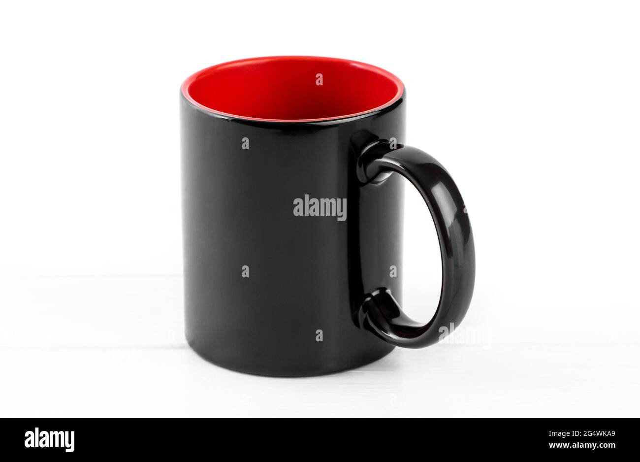 Blank black cup with red isolated on white background Stock Photo