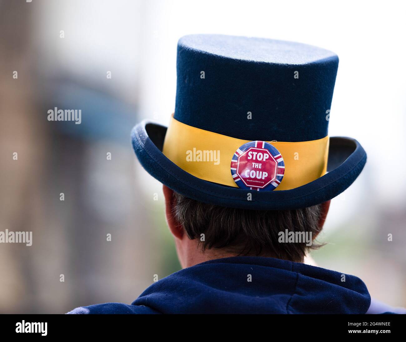 London, UK. 23rd June, 2021. An anti-Brexit activist seen with a sticker saying, stop the coup, on his hat during the UK-wide protest against “this corrupt government” called by Steve Bray at Parliament Square. Credit: SOPA Images Limited/Alamy Live News Stock Photo