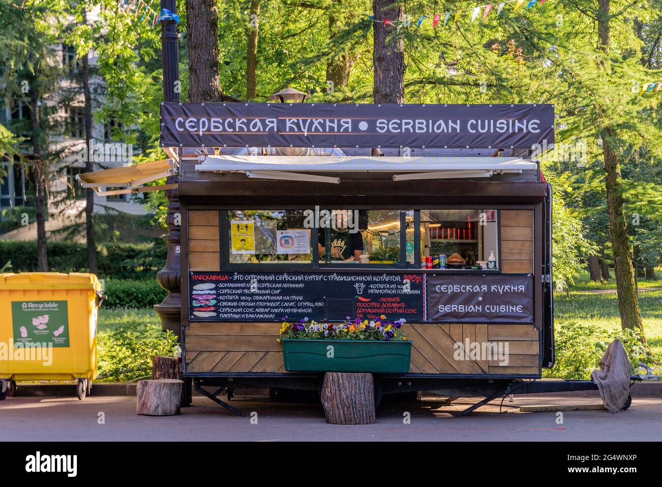 Serbian cuisine fast food kiosk made of wood in park in St Petersburg, Russia Stock Photo