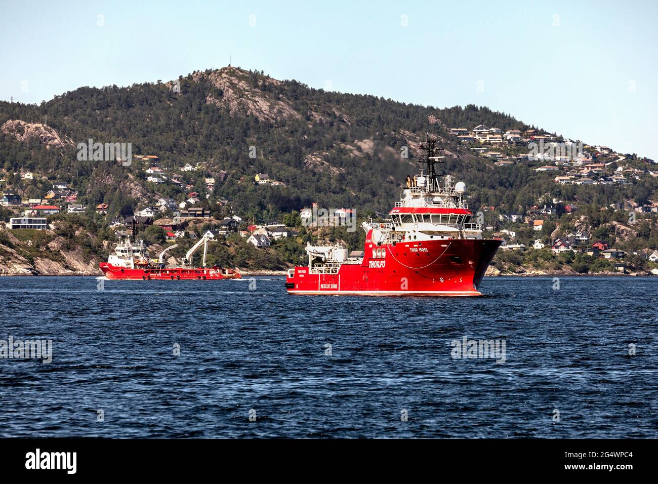 Offshore support and escort vessel Thor Modi, and supply AHTS vessel BB Ocean at Byfjorden, outside  port of Bergen, Norway. Stock Photo