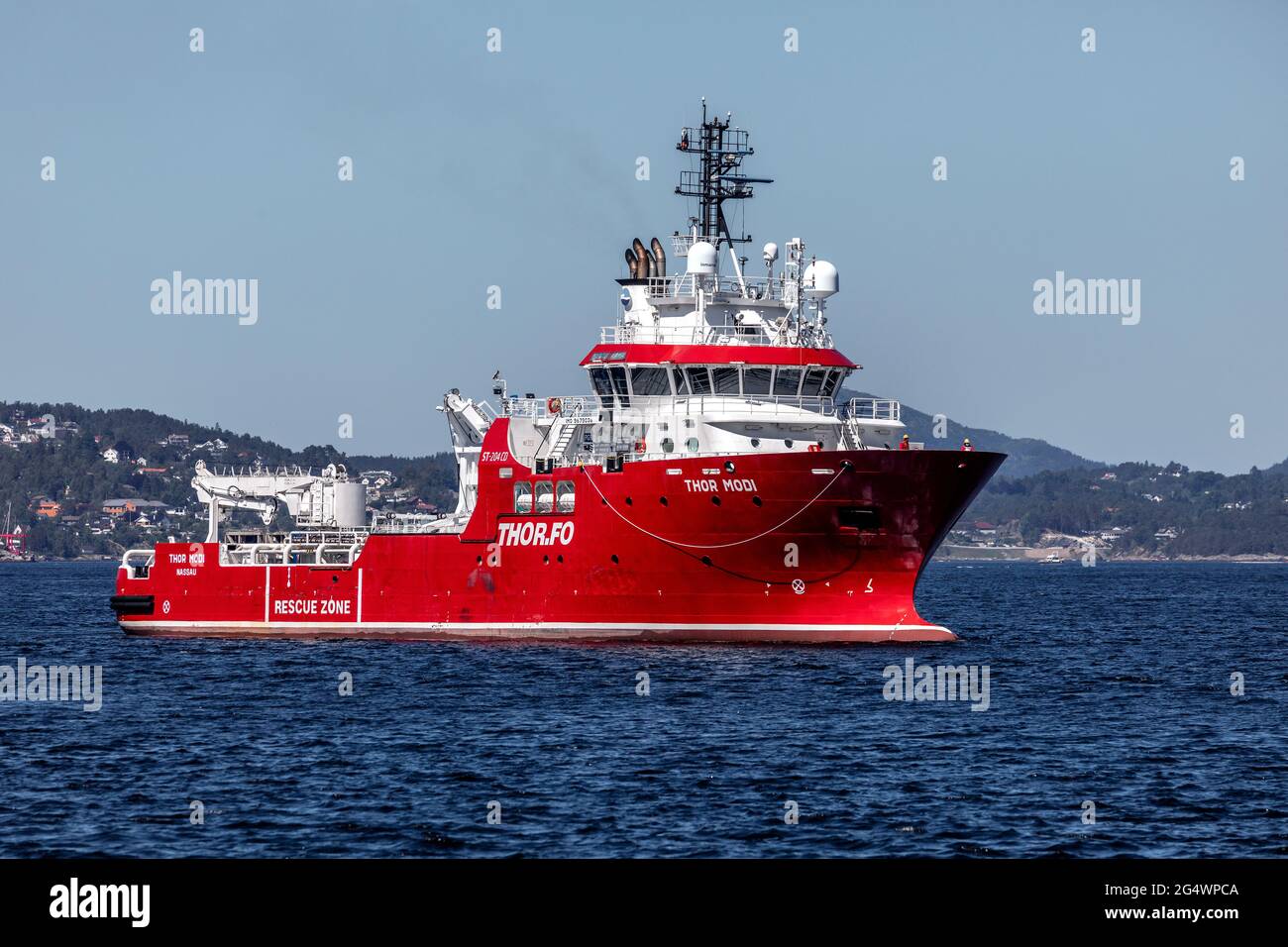 Offshore support and escort vessel Thor Modi at Byfjorden, outside  port of Bergen, Norway. Stock Photo