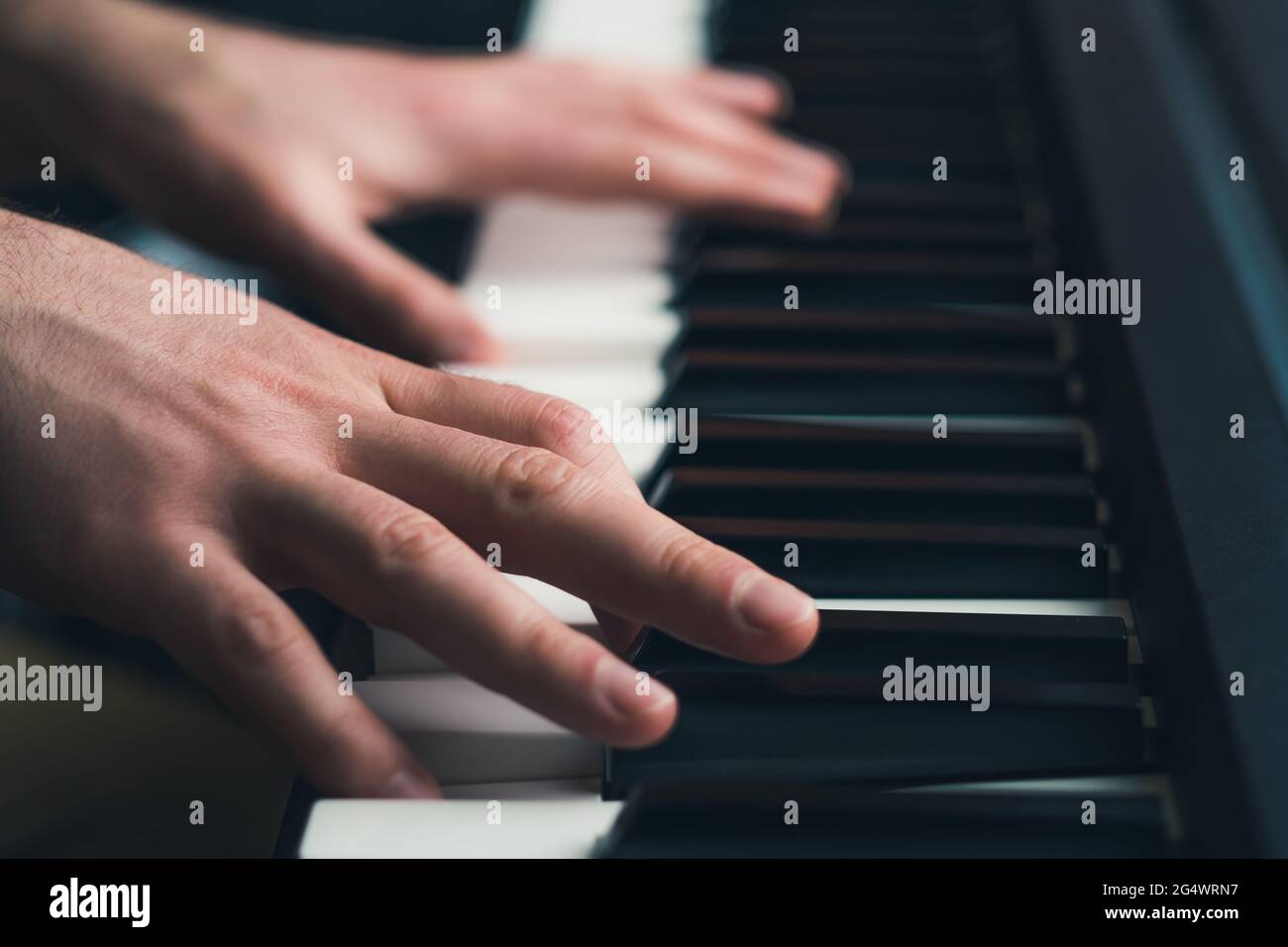 Man playing piano close up Stock Photo