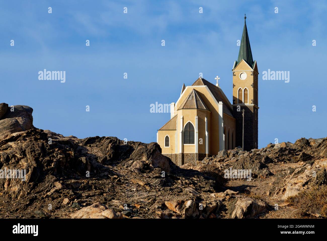 Lüderitz: Lutheran Felsenkirche above rocky landscape, Karas Region, Namibia Stock Photo